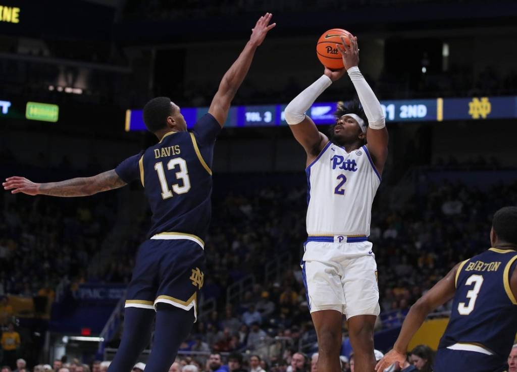 Pittsburgh Panthers Blake Hinson (2) attempts a three point shot over the head of Notre Dame Fighting Irish Tae Davis (13) during the second half on February 3, 2024 at the Petersen Events Center in Pittsburgh, PA.