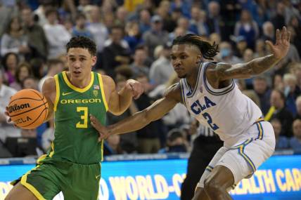 Feb 3, 2024; Los Angeles, California, USA; Oregon Ducks guard Jackson Shelstad (3) drives past UCLA Bruins guard Dylan Andrews (2) in the second half at Pauley Pavilion presented by Wescom. Mandatory Credit: Jayne Kamin-Oncea-USA TODAY Sports