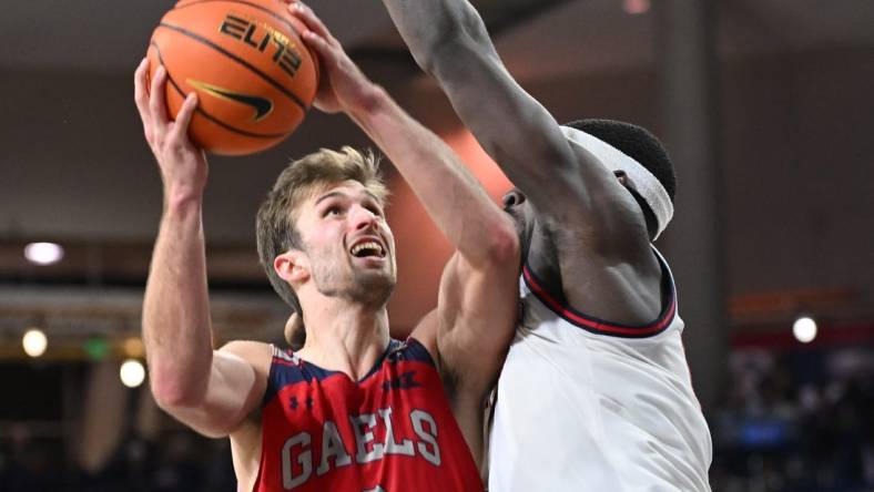 Feb 3, 2024; Spokane, Washington, USA; St. Mary's Gaels guard Augustas Marciulionis (3) shoots the ball against Gonzaga Bulldogs forward Graham Ike (13) in the second half at McCarthey Athletic Center. St. Mary's Gaels won 64-62. Mandatory Credit: James Snook-USA TODAY Sports