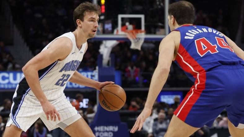 Feb 4, 2024; Detroit, Michigan, USA; Orlando Magic forward Franz Wagner (22) is defended by Detroit Pistons forward Bojan Bogdanovic (44) in the first half at Little Caesars Arena. Mandatory Credit: Rick Osentoski-USA TODAY Sports