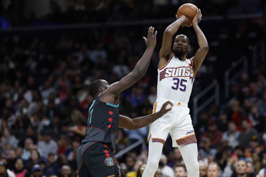 Feb 4, 2024; Washington, District of Columbia, USA; Phoenix Suns forward Kevin Durant (35) shoots the ball over Washington Wizards guard Bilal Coulibaly (0) in the first half at Capital One Arena. Mandatory Credit: Geoff Burke-USA TODAY Sports