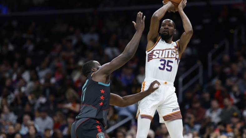 Feb 4, 2024; Washington, District of Columbia, USA; Phoenix Suns forward Kevin Durant (35) shoots the ball over Washington Wizards guard Bilal Coulibaly (0) in the first half at Capital One Arena. Mandatory Credit: Geoff Burke-USA TODAY Sports