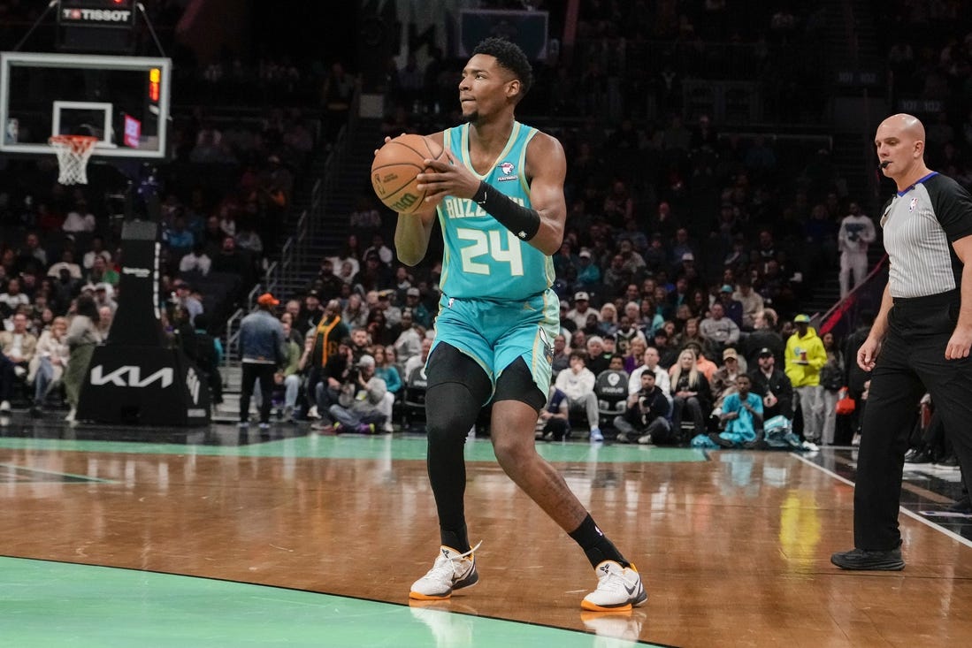 Feb 4, 2024; Charlotte, North Carolina, USA; Charlotte Hornets forward Brandon Miller (24) sets up for a jumper against the Indiana Pacers during the first quarter at Spectrum Center. Mandatory Credit: Jim Dedmon-USA TODAY Sports