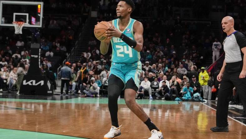 Feb 4, 2024; Charlotte, North Carolina, USA; Charlotte Hornets forward Brandon Miller (24) sets up for a jumper against the Indiana Pacers during the first quarter at Spectrum Center. Mandatory Credit: Jim Dedmon-USA TODAY Sports