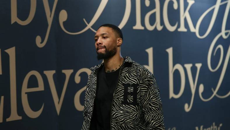 Feb 4, 2024; Salt Lake City, Utah, USA;  Milwaukee Bucks guard Damian Lillard (0) arrives at the Delta Center before the game against the Utah Jazz. Mandatory Credit: Chris Nicoll-USA TODAY Sports