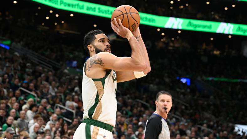 Feb 4, 2024; Boston, Massachusetts, USA; Boston Celtics forward Jayson Tatum (0)  shoots the ball against the Memphis Grizzlies during the first half at TD Garden. Mandatory Credit: Eric Canha-USA TODAY Sports