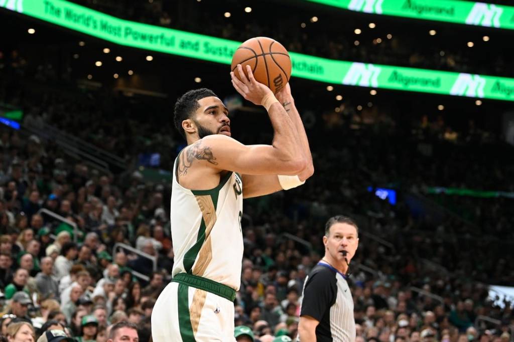 Feb 4, 2024; Boston, Massachusetts, USA; Boston Celtics forward Jayson Tatum (0)  shoots the ball against the Memphis Grizzlies during the first half at TD Garden. Mandatory Credit: Eric Canha-USA TODAY Sports