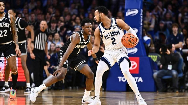 Feb 4, 2024; Philadelphia, Pennsylvania, USA; Villanova Wildcats guard Mark Armstrong (2) controls the ball against Providence Friars guard Jayden Pierre (1) in the first half at Wells Fargo Center. Mandatory Credit: Kyle Ross-USA TODAY Sports