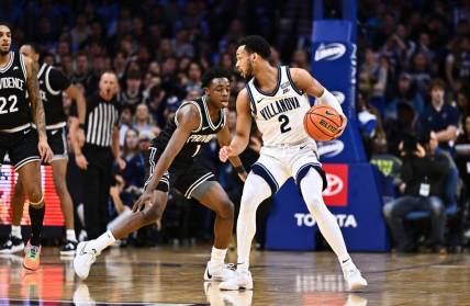 Feb 4, 2024; Philadelphia, Pennsylvania, USA; Villanova Wildcats guard Mark Armstrong (2) controls the ball against Providence Friars guard Jayden Pierre (1) in the first half at Wells Fargo Center. Mandatory Credit: Kyle Ross-USA TODAY Sports