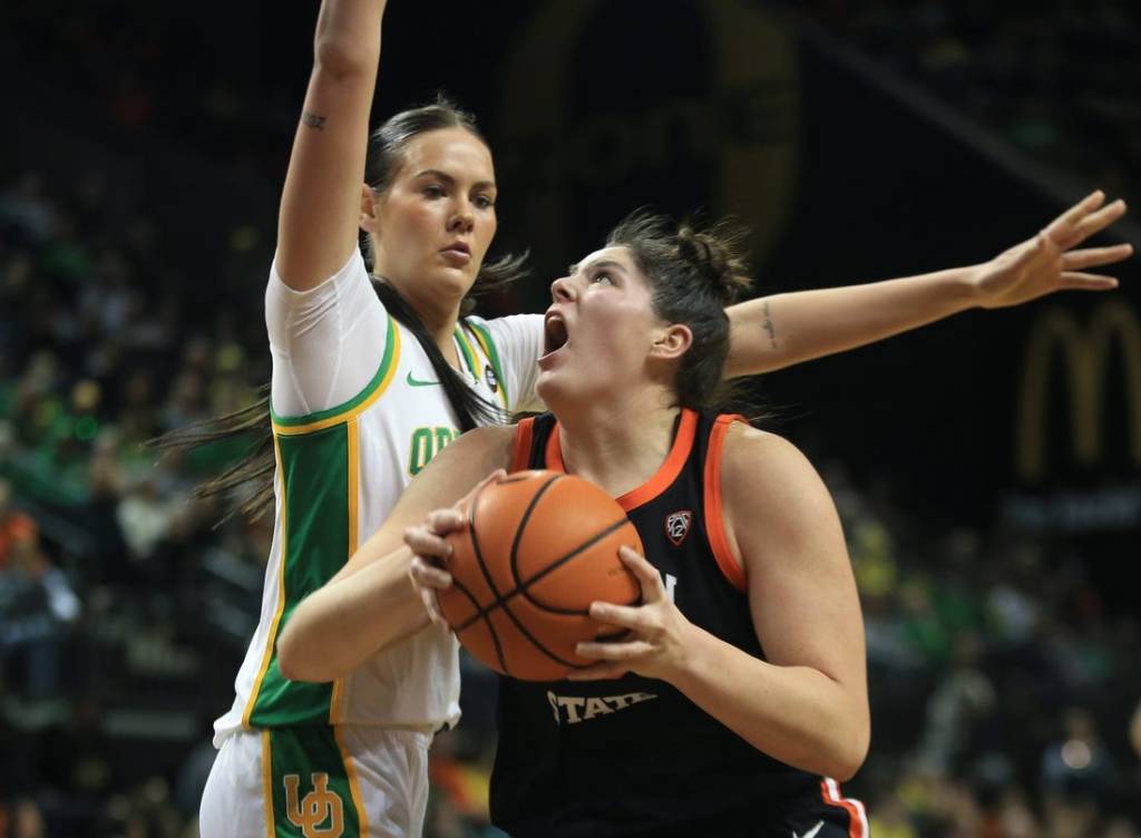 Oregon State   s Raegan Beers, right, battles Oregon   s Kennedy Basham for position under the basket during the first half at Matthew Knight Arena Sunday, Feb 4, 2024.