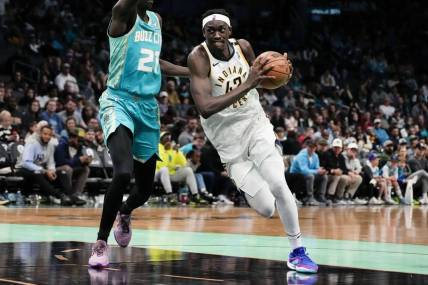 Feb 4, 2024; Charlotte, North Carolina, USA; Indiana Pacers forward Pascal Siakam (43) drives to the basket against Charlotte Hornets forward JT Thor (21) during the second half at Spectrum Center. Mandatory Credit: Jim Dedmon-USA TODAY Sports