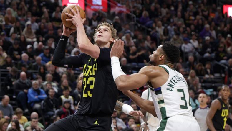 Feb 4, 2024; Salt Lake City, Utah, USA;  Utah Jazz forward Lauri Markkanen (23) looks past Milwaukee Bucks forward Giannis Antetokounmpo (34) and to the basket during the second quarter at Delta Center. Mandatory Credit: Chris Nicoll-USA TODAY Sports