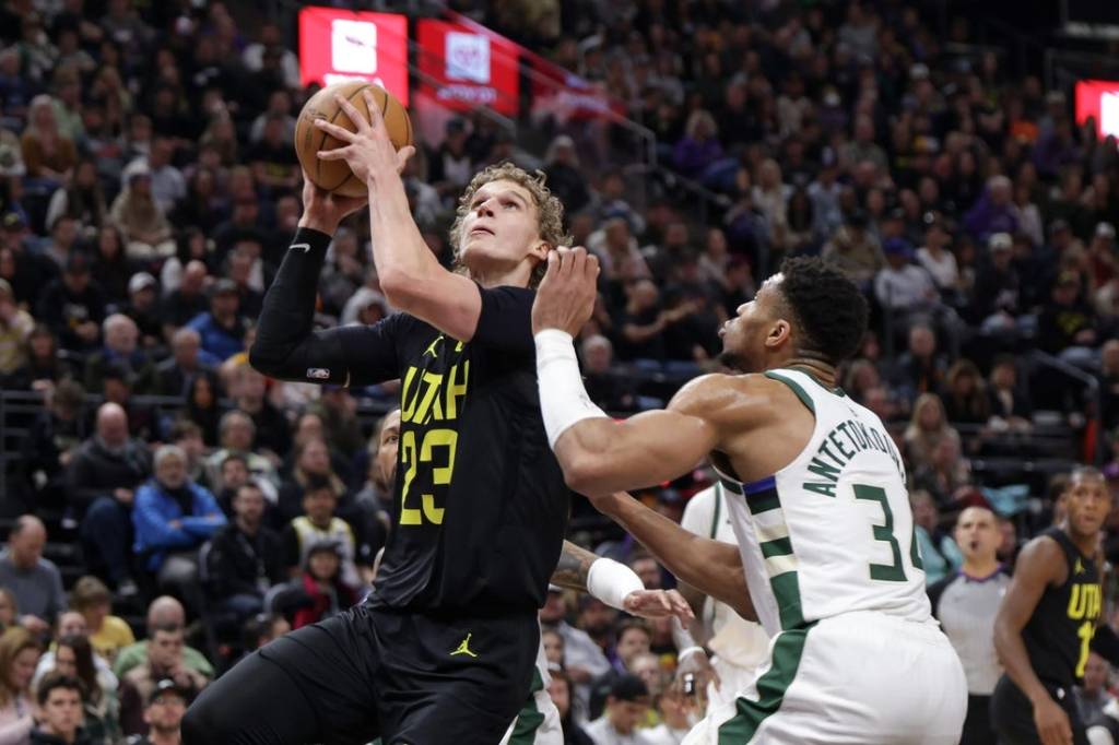 Feb 4, 2024; Salt Lake City, Utah, USA;  Utah Jazz forward Lauri Markkanen (23) looks past Milwaukee Bucks forward Giannis Antetokounmpo (34) and to the basket during the second quarter at Delta Center. Mandatory Credit: Chris Nicoll-USA TODAY Sports