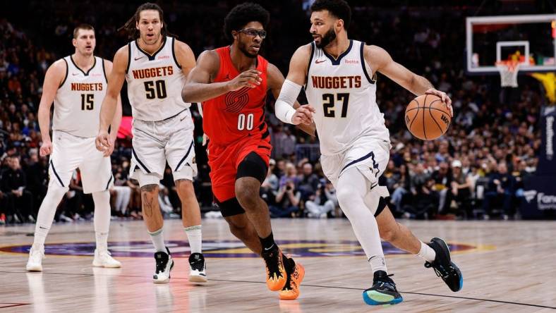 Feb 4, 2024; Denver, Colorado, USA; Denver Nuggets guard Jamal Murray (27) controls the ball against Portland Trail Blazers guard Scoot Henderson (00) as forward Aaron Gordon (50) and center Nikola Jokic (15) defend in the second quarter at Ball Arena. Mandatory Credit: Isaiah J. Downing-USA TODAY Sports