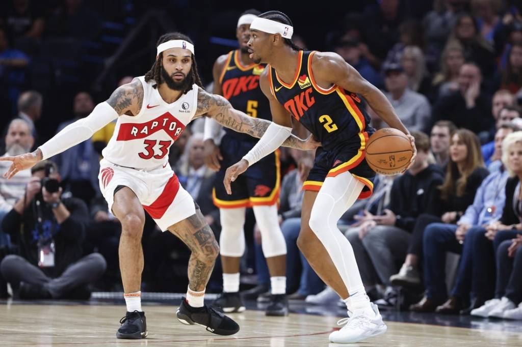 Feb 4, 2024; Oklahoma City, Oklahoma, USA; Oklahoma City Thunder guard Shai Gilgeous-Alexander (2) moves the ball against Toronto Raptors guard Gary Trent Jr. (33) during the second half at Paycom Center. Mandatory Credit: Alonzo Adams-USA TODAY Sports