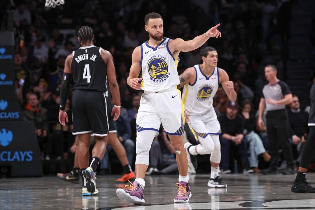 Feb 5, 2024; Brooklyn, New York, USA; Golden State Warriors guard Stephen Curry (30) reacts after making a three point basket during the first half against the Brooklyn Nets at Barclays Center. Mandatory Credit: Vincent Carchietta-USA TODAY Sports