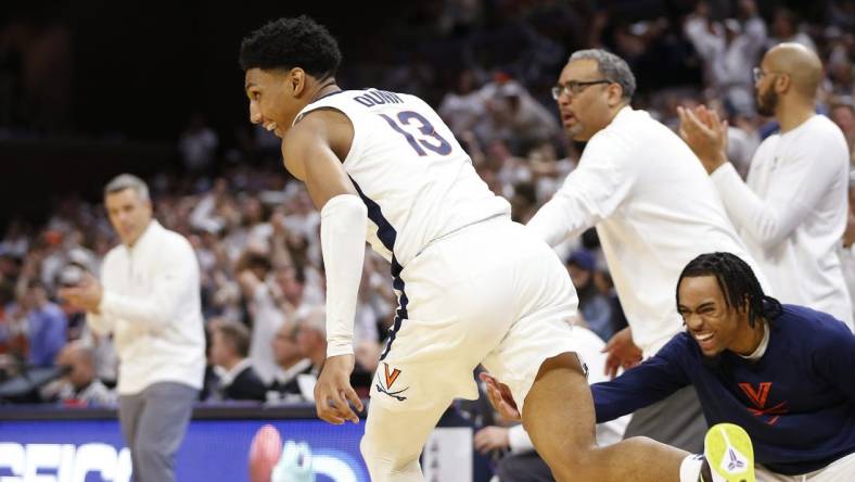 Feb 5, 2024; Charlottesville, Virginia, USA; Virginia Cavaliers guard Ryan Dunn (13) celebrates after dunking the ball against the Miami (Fl) Hurricanes during the second half at John Paul Jones Arena. Mandatory Credit: Amber Searls-USA TODAY Sports