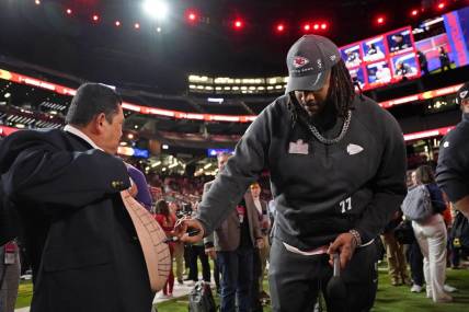 Feb 5, 2024; Las Vegas, NV, USA; Kansas City Chiefs offensive tackle Lucas Niang (77) draws on the stomach of Guillermo Rodriguez Super Bowl LVIII Opening Night at Allegiant Stadium. Mandatory Credit: Lucas Peltier-USA TODAY Sports