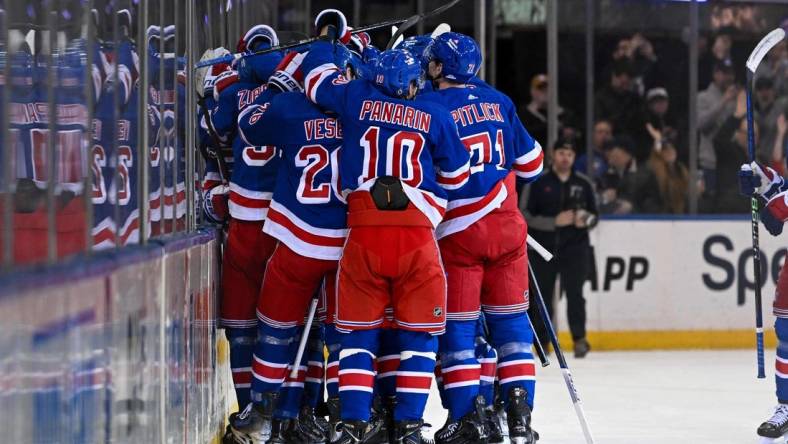 Feb 5, 2024; New York, New York, USA;  New York Rangers celebrate the 2-1 victory over Colorado Avalanche after the overtime period at Madison Square Garden. Mandatory Credit: Dennis Schneidler-USA TODAY Sports