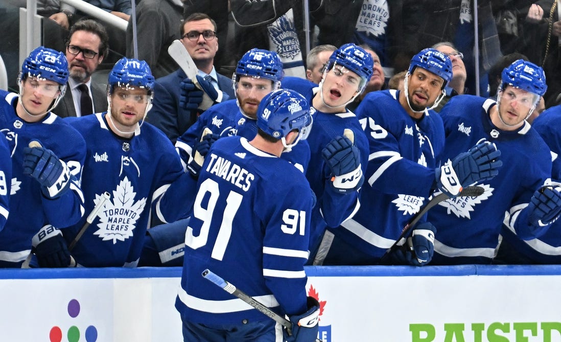 Feb 5, 2024; Toronto, Ontario, CAN;   Toronto Maple Leafs forward John Tavares (91) celebrates with team mates at the bench after scoring a goal against the New York Islanders in the third period at Scotiabank Arena. Mandatory Credit: Dan Hamilton-USA TODAY Sports