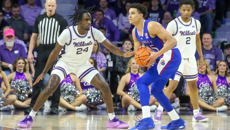 Feb 5, 2024; Manhattan, Kansas, USA; Kansas Jayhawks guard Kevin McCullar Jr. (15) is guarded by Kansas State Wildcats forward Arthur Maluma (24) during the first half at Bramlage Coliseum. Mandatory Credit: Scott Sewell-USA TODAY Sports