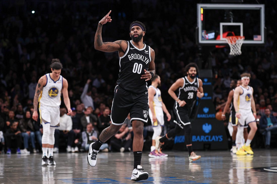Feb 5, 2024; Brooklyn, New York, USA; Brooklyn Nets forward Royce O'Neale (00) reacts after making a three point basket during the second half against the Golden State Warriors at Barclays Center. Mandatory Credit: Vincent Carchietta-USA TODAY Sports