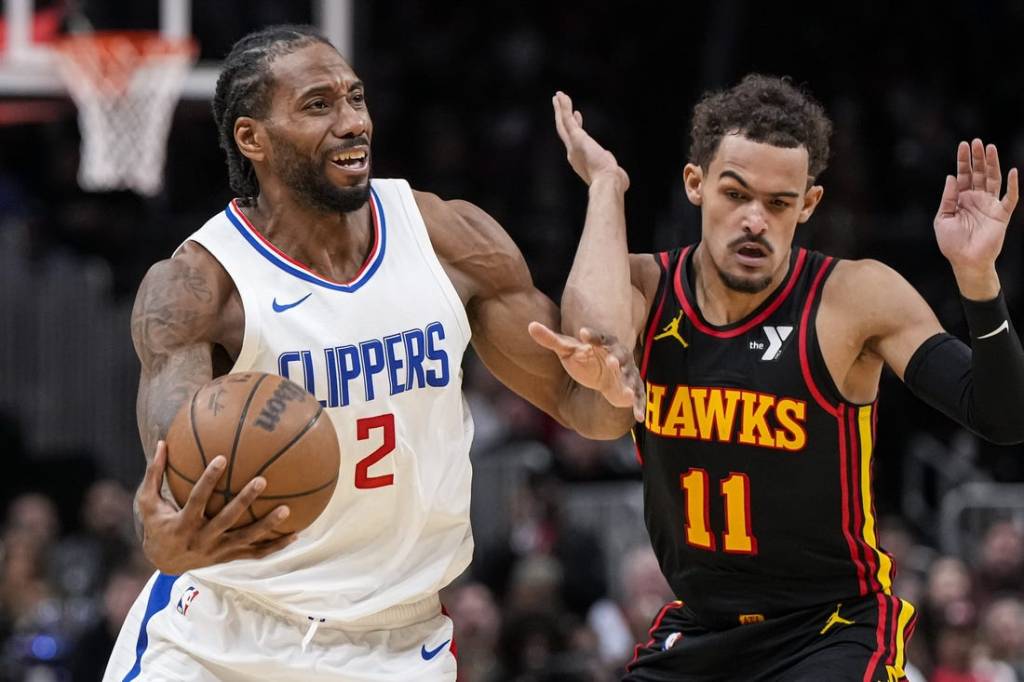 Feb 5, 2024; Atlanta, Georgia, USA; LA Clippers forward Kawhi Leonard (2) fights past Atlanta Hawks guard Trae Young (11) during the second half at State Farm Arena. Mandatory Credit: Dale Zanine-USA TODAY Sports