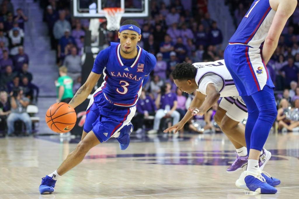 Feb 5, 2024; Manhattan, Kansas, USA; Kansas Jayhawks guard Dejuan Harris Jr. (3) dribbles around a pick on Kansas State Wildcats guard Tylor Perry (2) during the second half at Bramlage Coliseum. Mandatory Credit: Scott Sewell-USA TODAY Sports