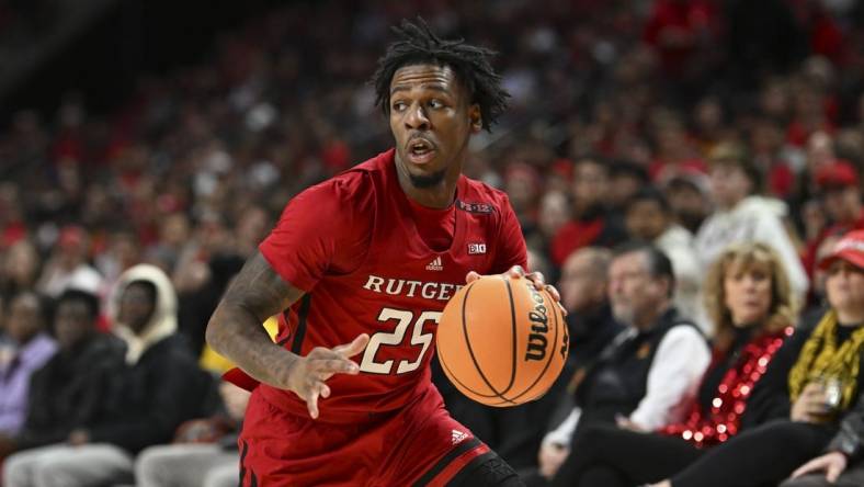 Feb 6, 2024; College Park, Maryland, USA; Rutgers Scarlet Knights guard Jeremiah Williams (25) makes a move to the basket during the first half  against the Maryland Terrapins at Xfinity Center. Mandatory Credit: Tommy Gilligan-USA TODAY Sports