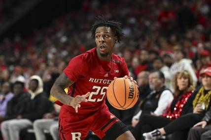 Feb 6, 2024; College Park, Maryland, USA; Rutgers Scarlet Knights guard Jeremiah Williams (25) makes a move to the basket during the first half  against the Maryland Terrapins at Xfinity Center. Mandatory Credit: Tommy Gilligan-USA TODAY Sports