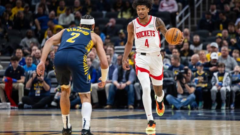 Feb 6, 2024; Indianapolis, Indiana, USA;  Houston Rockets guard Jalen Green (4) dribbles the ball while Indiana Pacers guard Andrew Nembhard (2) defends in the first half at Gainbridge Fieldhouse. Mandatory Credit: Trevor Ruszkowski-USA TODAY Sports