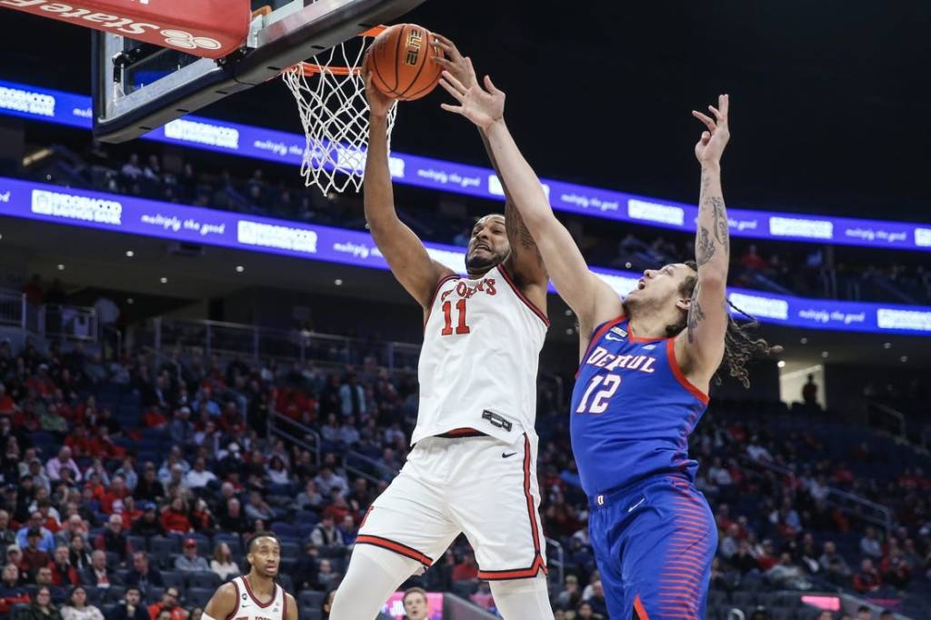 Feb 6, 2024; Elmont, New York, USA; St. John's Red Storm center Joel Soriano (11) and DePaul Blue Demons forward Mac Etienne (12) fight for a rebound in the first half at UBS Arena. Mandatory Credit: Wendell Cruz-USA TODAY Sports