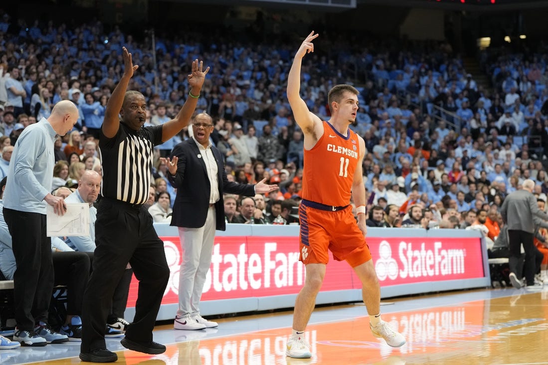 Feb 6, 2024; Chapel Hill, North Carolina, USA;  Clemson Tigers guard Joseph Girard III (11) reacts after hitting a three point shot in the first half at Dean E. Smith Center. Mandatory Credit: Bob Donnan-USA TODAY Sports