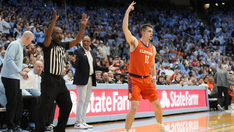 Feb 6, 2024; Chapel Hill, North Carolina, USA;  Clemson Tigers guard Joseph Girard III (11) reacts after hitting a three point shot in the first half at Dean E. Smith Center. Mandatory Credit: Bob Donnan-USA TODAY Sports