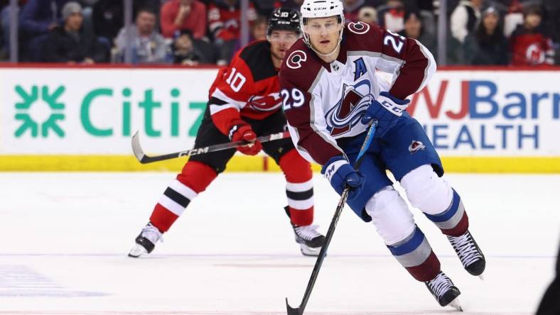 Feb 6, 2024; Newark, New Jersey, USA; Colorado Avalanche center Nathan MacKinnon (29) skates with the puck against the New Jersey Devils during the first period at Prudential Center. Mandatory Credit: Ed Mulholland-USA TODAY Sports