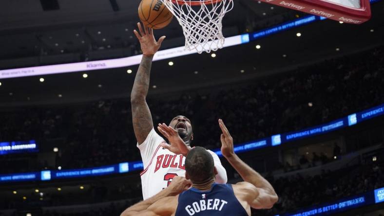 Feb 6, 2024; Chicago, Illinois, USA; Chicago Bulls center Andre Drummond (3) shoots over Minnesota Timberwolves center Rudy Gobert (27) during the first quarter at United Center. Mandatory Credit: David Banks-USA TODAY Sports