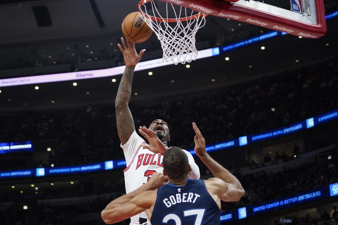 Feb 6, 2024; Chicago, Illinois, USA; Chicago Bulls center Andre Drummond (3) shoots over Minnesota Timberwolves center Rudy Gobert (27) during the first quarter at United Center. Mandatory Credit: David Banks-USA TODAY Sports