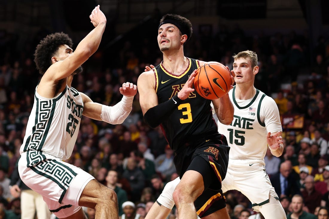 Feb 6, 2024; Minneapolis, Minnesota, USA; Minnesota Golden Gophers forward Dawson Garcia (3) works around Michigan State Spartans forward Malik Hall (25) and center Carson Cooper (15) during the first half at Williams Arena. Mandatory Credit: Matt Krohn-USA TODAY Sports