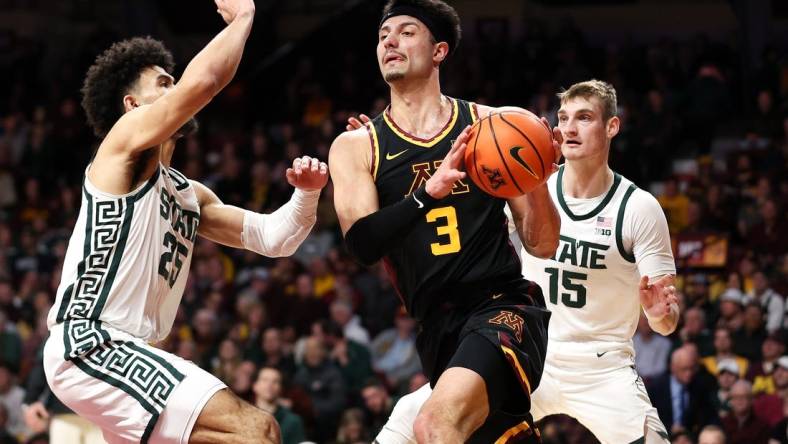 Feb 6, 2024; Minneapolis, Minnesota, USA; Minnesota Golden Gophers forward Dawson Garcia (3) works around Michigan State Spartans forward Malik Hall (25) and center Carson Cooper (15) during the first half at Williams Arena. Mandatory Credit: Matt Krohn-USA TODAY Sports