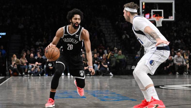 Feb 6, 2024; Brooklyn, New York, USA; Brooklyn Nets guard Spencer Dinwiddie (26) makes a move against Dallas Mavericks guard Luka Doncic (77) during the fourth quarter at Barclays Center. Mandatory Credit: John Jones-USA TODAY Sports