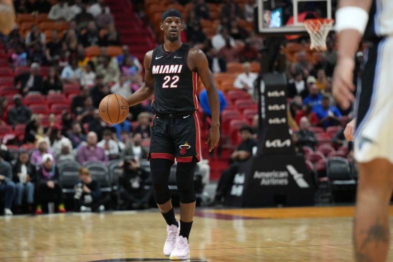 Feb 6, 2024; Miami, Florida, USA;  Miami Heat forward Jimmy Butler (22) brings the ball up the court against the Orlando Magic during the first half at Kaseya Center. Mandatory Credit: Jim Rassol-USA TODAY Sports