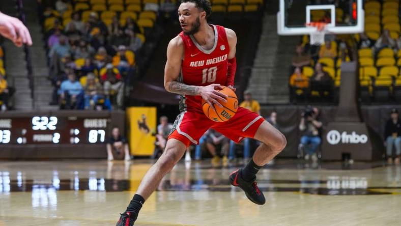 Feb 6, 2024; Laramie, Wyoming, USA; New Mexico Lobos guard Jaelen House (10) looks to pass against the Wyoming Cowboys during the second half at Arena-Auditorium. Mandatory Credit: Troy Babbitt-USA TODAY Sports