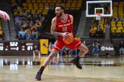 Feb 6, 2024; Laramie, Wyoming, USA; New Mexico Lobos guard Jaelen House (10) looks to pass against the Wyoming Cowboys during the second half at Arena-Auditorium. Mandatory Credit: Troy Babbitt-USA TODAY Sports