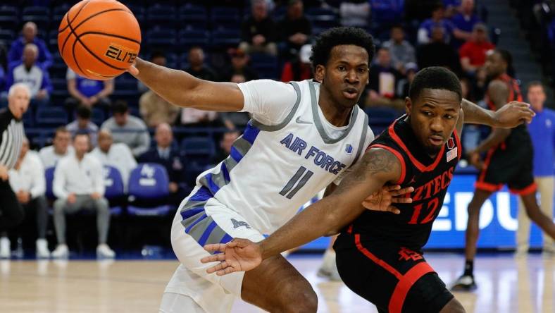 Feb 6, 2024; Colorado Springs, Colorado, USA; Air Force Falcons guard Byron Brown (11) and San Diego State Aztecs guard Darrion Trammell (12) battle for the ball in the first half at Clune Arena. Mandatory Credit: Isaiah J. Downing-USA TODAY Sports