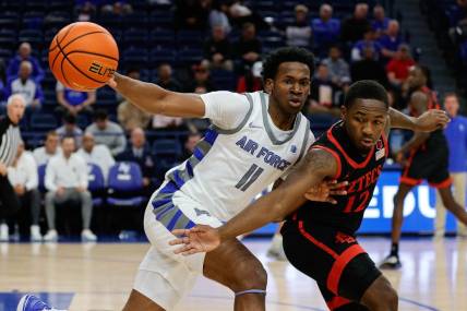 Feb 6, 2024; Colorado Springs, Colorado, USA; Air Force Falcons guard Byron Brown (11) and San Diego State Aztecs guard Darrion Trammell (12) battle for the ball in the first half at Clune Arena. Mandatory Credit: Isaiah J. Downing-USA TODAY Sports