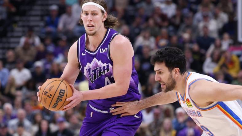 Feb 6, 2024; Salt Lake City, Utah, USA; Utah Jazz forward Kelly Olynyk (41) moves the ball against Oklahoma City Thunder guard Vasilije Micic (29) during the fourth quarter at Delta Center. Mandatory Credit: Rob Gray-USA TODAY Sports