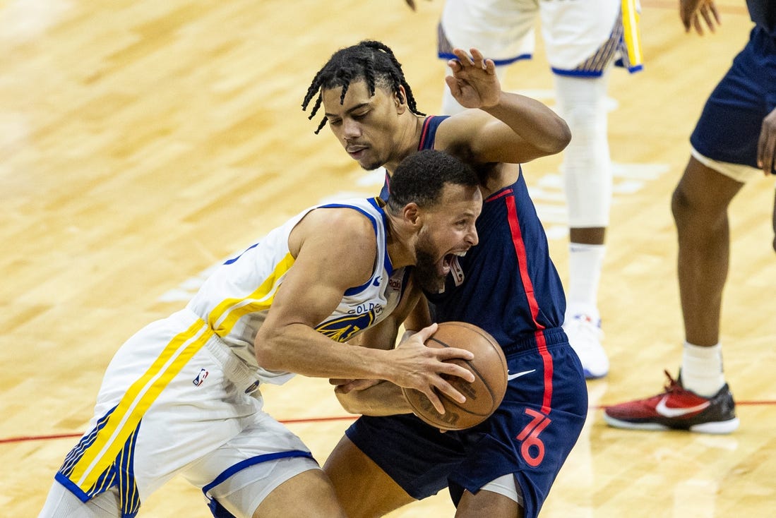 Feb 7, 2024; Philadelphia, Pennsylvania, USA; Golden State Warriors guard Stephen Curry (30) drives against Philadelphia 76ers guard Jaden Springer (11) during the second quarter at Wells Fargo Center. Mandatory Credit: Bill Streicher-USA TODAY Sports