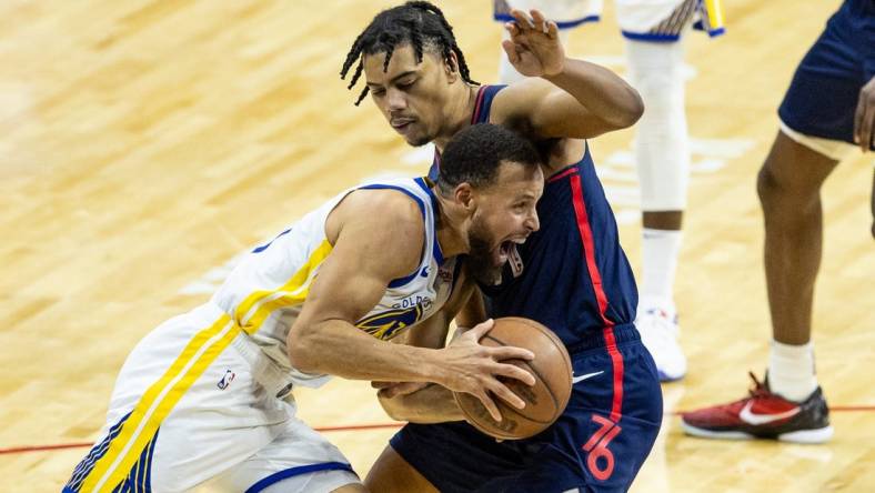 Feb 7, 2024; Philadelphia, Pennsylvania, USA; Golden State Warriors guard Stephen Curry (30) drives against Philadelphia 76ers guard Jaden Springer (11) during the second quarter at Wells Fargo Center. Mandatory Credit: Bill Streicher-USA TODAY Sports