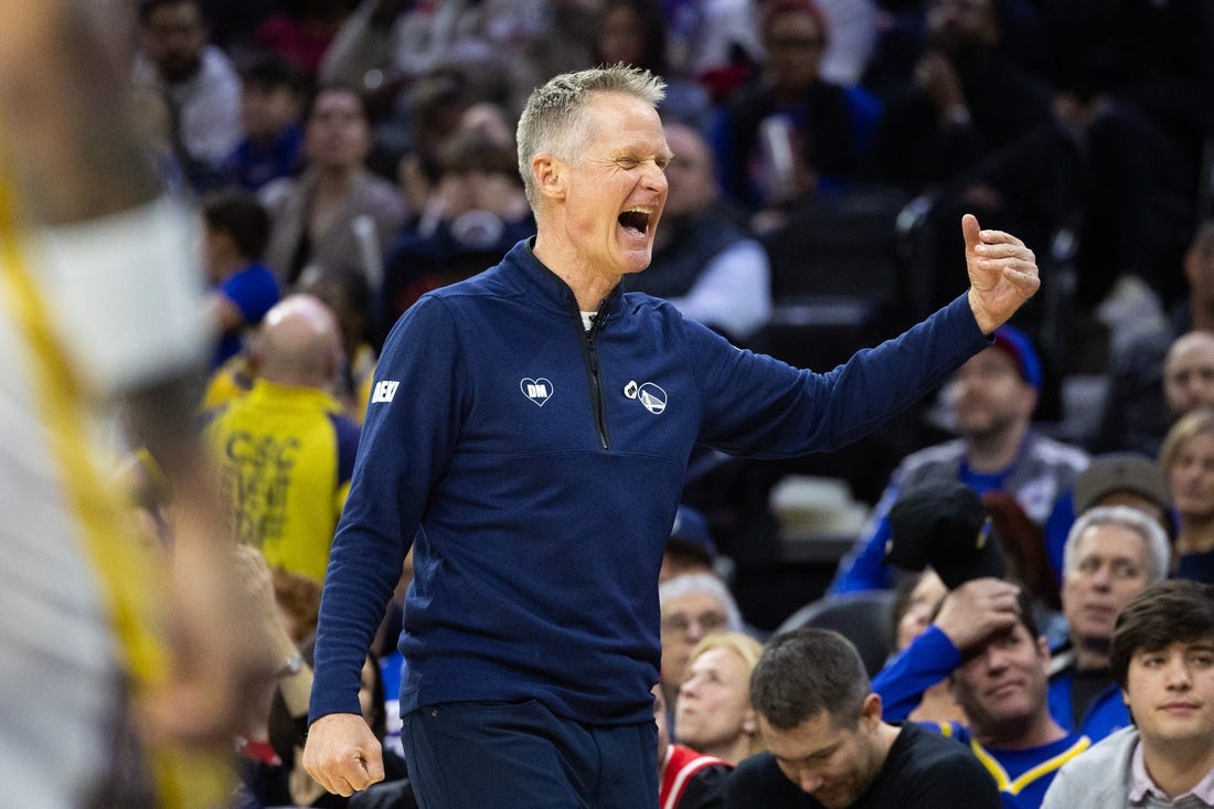 Feb 7, 2024; Philadelphia, Pennsylvania, USA; Golden State Warriors head coach Steve Kerr reacts after a score against the Philadelphia 76ers during the third quarter at Wells Fargo Center. Mandatory Credit: Bill Streicher-USA TODAY Sports