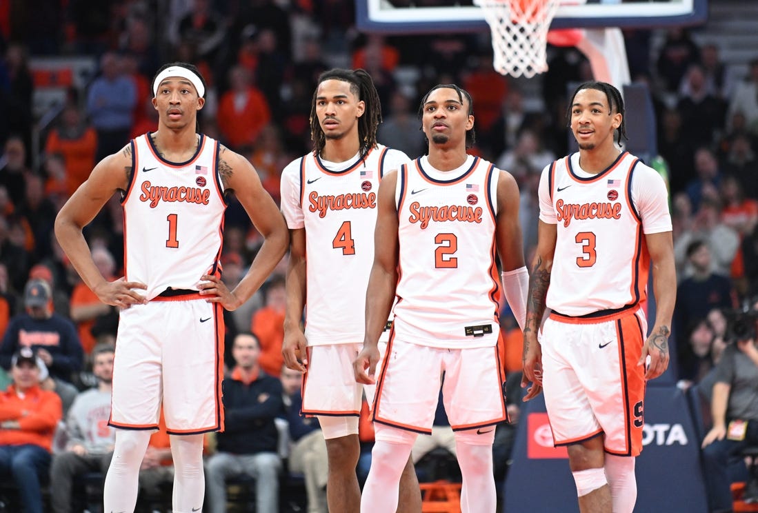 Feb 7, 2024; Syracuse, New York, USA; Syracuse Orange forward Maliq Brown (1) and forward Chris Bell (4) and guard JJ Starling (2) and guard Judah Mintz (3) watch a free throw down court in the second half against the Louisville Cardinals at the JMA Wireless Dome. Mandatory Credit: Mark Konezny-USA TODAY Sports